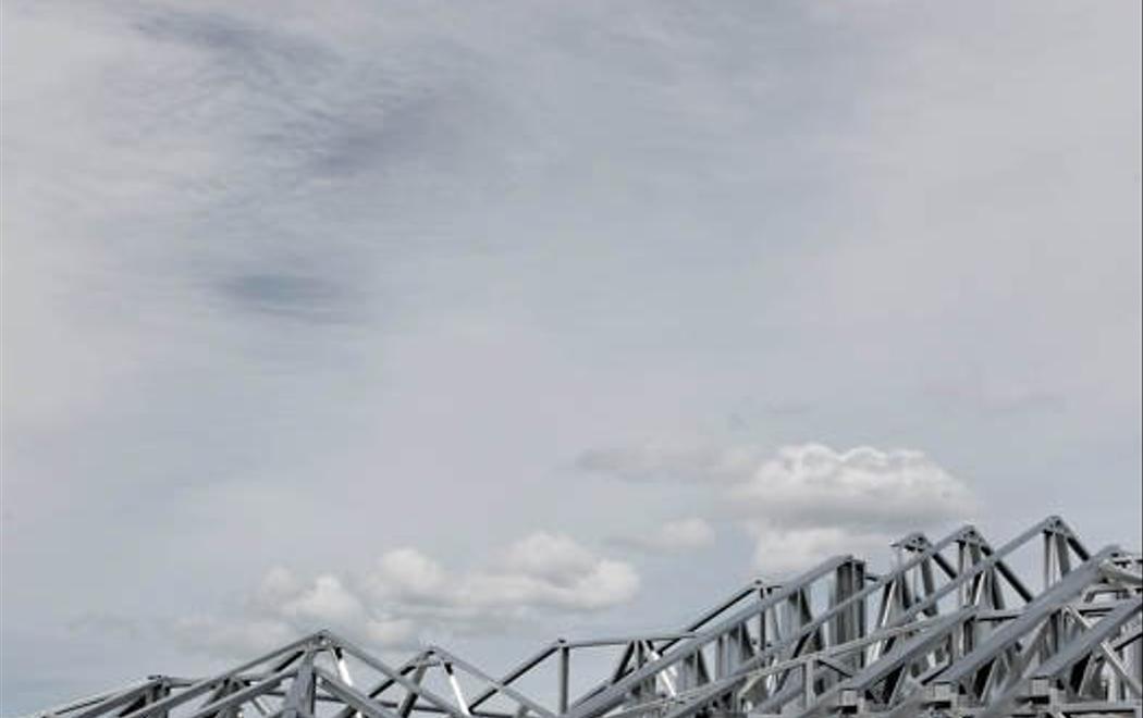 Cloudy sky with a landscape of steel mountains